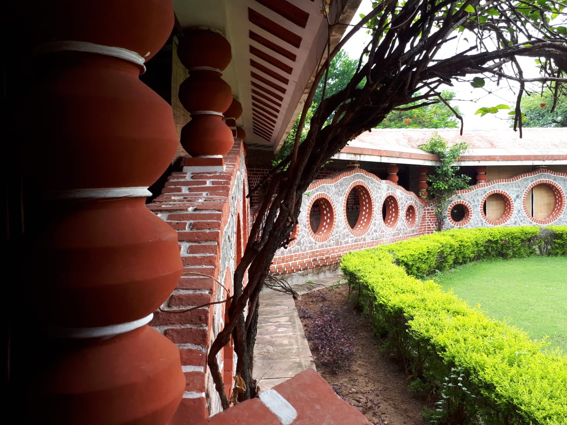 grass-panchkarm-area-mud-clocks